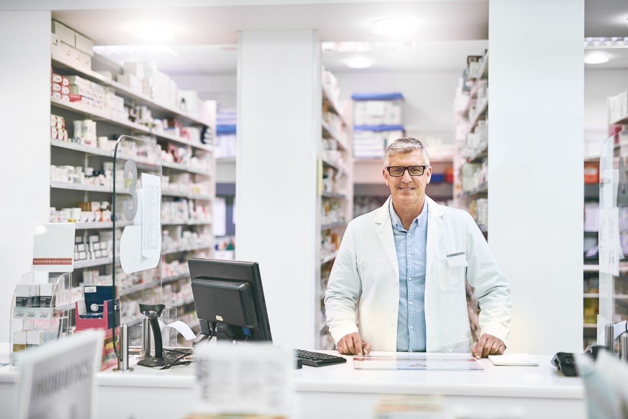 pharmacist standing in the pharmacy